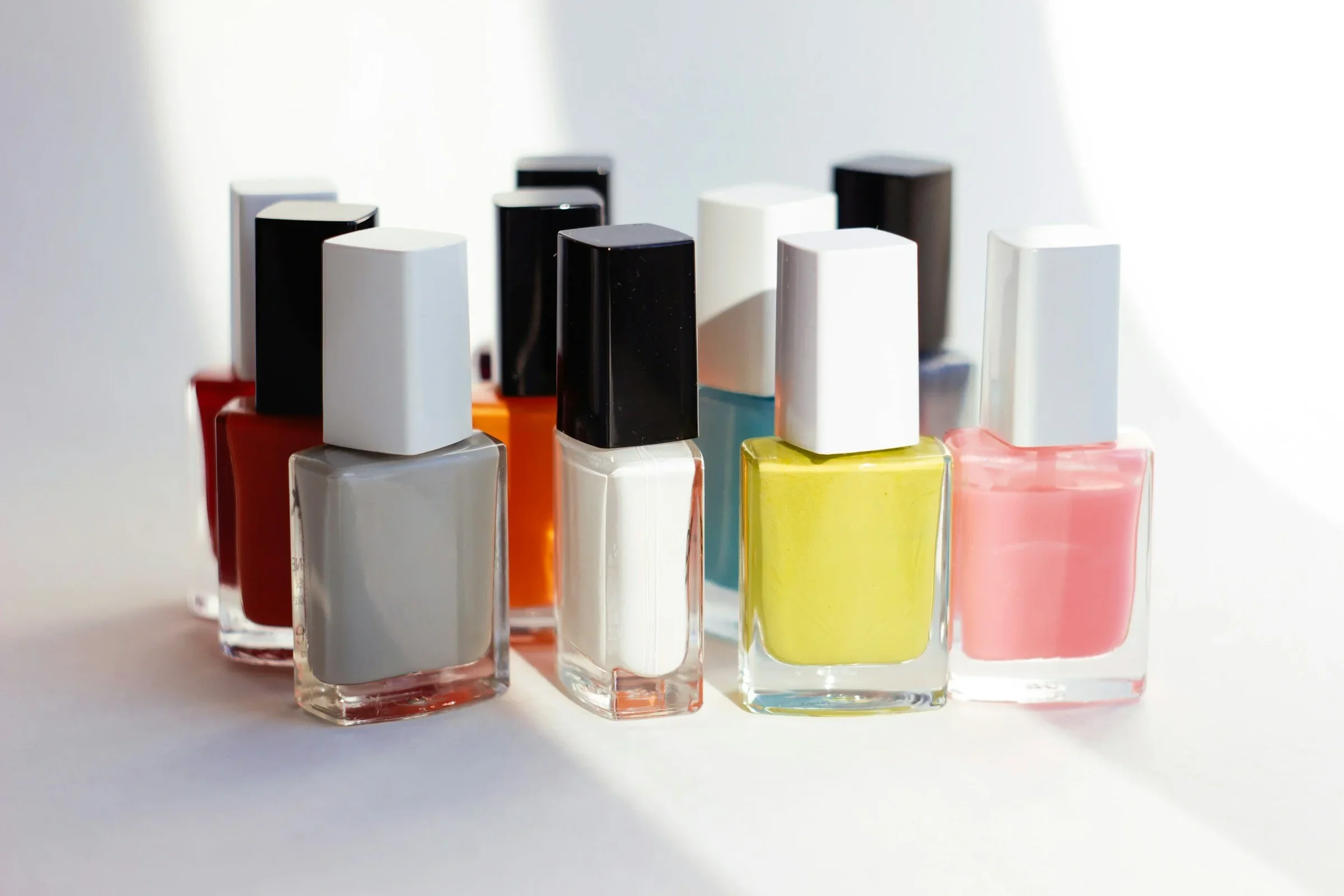 A variety of colorful nail polish bottles